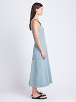 Side full length image of model wearing Arlet Sleeveless Dress In Stretch Twill in GREY INDIGO