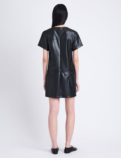 Back full length image of model wearing Sonny Dress In Faux Leather in BLACK