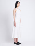 Side full length image of model wearing Juno Dress In Broderie Anglaise in OFF WHITE