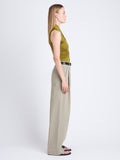 Side full length image of model wearing Florence Top In Matte Crepe Jersey in OLIVE