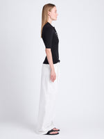Side full length image of model wearing Amber Pant In Solid Cotton Crinkle in OFF WHITE