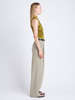 Side full length image of model wearing Amber Pant In Solid Cotton Crinkle in BAYLEAF