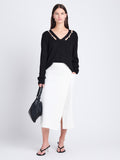 Front full length image of model wearing Elsie Top In Midweight Button Details Knits in BLACK