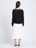 Back full length image of model wearing Elsie Top In Midweight Button Details Knits in BLACK