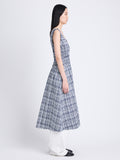 Side full length image of model wearing Penny Dress in Grid Poplin in NAVY/OFF WHITE