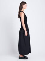 Side full length image of model wearing Malia Dress in Peached Poplin in BLACK