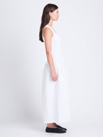 Side full length image of model wearing Malia Dress in Peached Poplin in WHITE