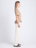 Side full length image of model wearing Mira T-Shirt in Jersey in KHAKI