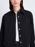 Detail image of model wearing Alma Shirt in Peached Poplin in BLACK