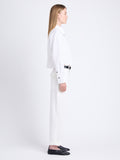 Side full length image of model wearing Alma Shirt in Peached Poplin in WHITE