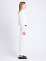 Side full length image of model wearing Alma Shirt in Peached Poplin in WHITE