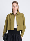 Front cropped image of model wearing Alma Shirt in Peached Poplin in OLIVE