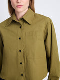 Detail image of model wearing Alma Shirt in Peached Poplin in OLIVE
