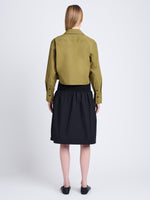Back full length image of model wearing Olive Skirt in Peached Poplin in BLACK