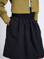 Detail image of model wearing Olive Skirt in Peached Poplin in BLACK