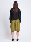 Back image of model wearing Olive Skirt in Peached Poplin in OLIVE