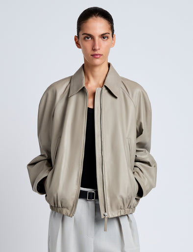 Proenza Schouler Front cropped image of model wearing Beck Bomber in Lightweight Nappa in Granite