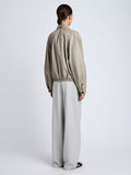 Proenza Schouler Back full length image of model wearing Beck Bomber in Lightweight Nappa in Granite