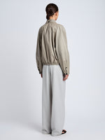 Proenza Schouler Back full length image of model wearing Beck Bomber in Lightweight Nappa in Granite