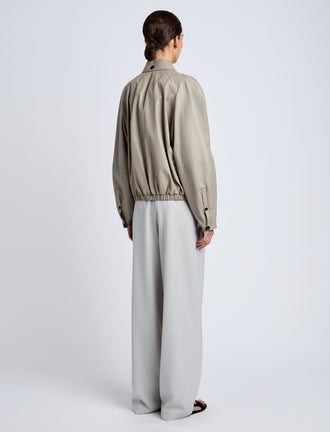 Proenza Schouler Back full length image of model wearing Beck Bomber in Lightweight Nappa in Granite