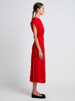 Proenza Schouler Side full length image of model wearing Rosalyn Skirt in Pleated Jersey in Dark Poppy