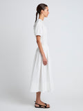 Proenza Schouler Side full length image of model wearing Austin Skirt In Cotton Sateen in White