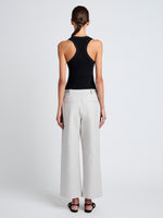 Proenza Schouler Back full length image of model wearing Cali Pant in Stretch Cotton Suiting in Pale Grey