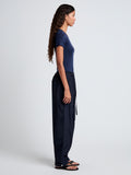 Proenza Schouler side full length image of model wearing Aston Pant in Tech Cotton in Navy