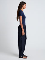 Proenza Schouler side full length image of model wearing Aston Pant in Tech Cotton in Navy