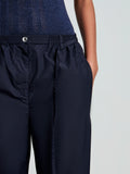 Proenza Schouler detail image of model wearing Aston Pant in Tech Cotton in Navy