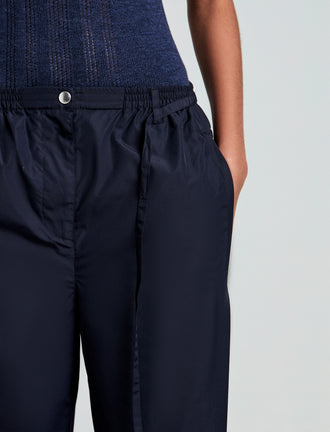 Proenza Schouler detail image of model wearing Aston Pant in Tech Cotton in Navy