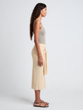 Proenza Schouler Side full length image of model wearing Phelan Knit Skirt in Linen Twist in Light Wheat