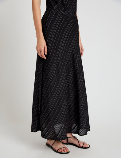Proenza Schouler detail image of model wearing Kaia Skirt in Woven Stripe Flou in black/chalk