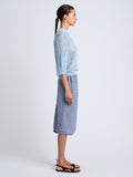 Proenza Schouler side image of model wearing Lori Knit Skirt in Plaid Knit in off white/denim