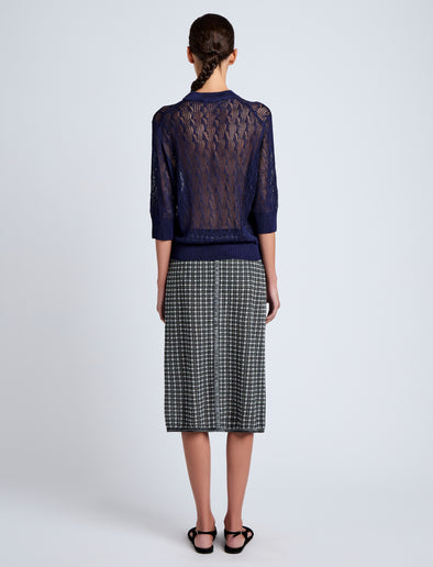 Proenza Schouler Back full length image of model wearing Nicola Knit Sweater in Plaited Viscose Rib in Dark Ink