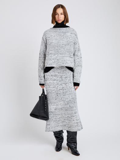 Proenza Schouler Front full length image of model wearing Maddox Sweater in Marled Cotton in Bone, black melange