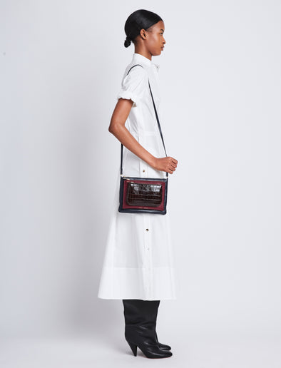 Image of model wearing Triple Zip Pouch in DEEP NAVY/GARNET/MOCHA