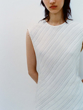 Cropped image of model wearing the Kaia Skirt in Woven Stripe Flou in Chalk/Black