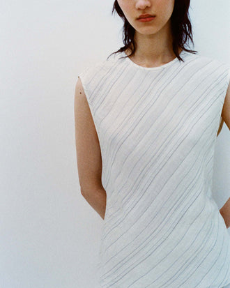 Cropped image of model wearing the Kaia Skirt in Woven Stripe Flou in Chalk/Black