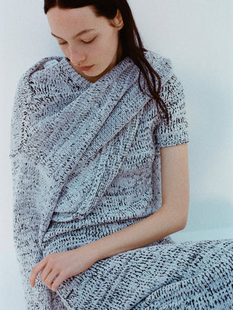 Image of model wearing Mel Dress in Marled Cotton in Bone, black melange and Maddox Sweater in Marled Cotton in Bone, black melange against a white background