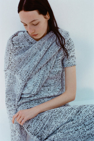 Image of model wearing Mel Dress in Marled Cotton in Bone, black melange and Maddox Sweater in Marled Cotton in Bone, black melange against a white background