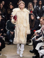 Image of model walking Proenza Schouler Fall Winter 2024 Runway wearing Fiona Coat in Shearling in resin