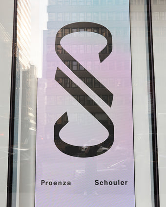 image of a media screen with the Proenza Schouler monogram symbol and official Proenza Schouler text beneath the monogram