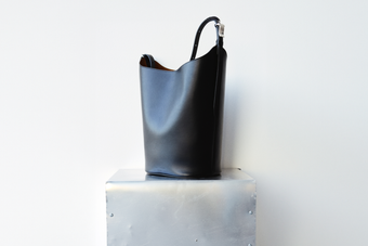 Brant Bucket Bag in Smooth Calf in black on silver platform