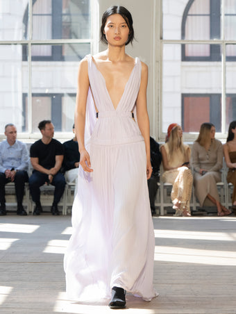Image of model walking Proenza Schouler SS25 Runway wearing Serra Dress in Matte Jersey in Lilac and Slash Tie Sandal in BLACK