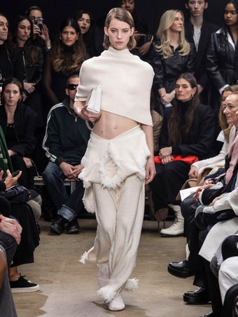 Image of model walking Proenza Schouler Fall Winter 2024 Runway wearing Shawl in Textured Knits in ivory