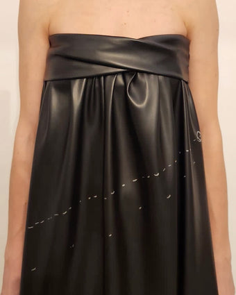Image of the black leather dress from Fall Winter 2023 in early fittings stages