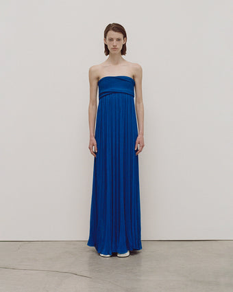 Full body image from Pre-Spring 2024 Lookbook of the Rina Dress in Cobalt Gauze Viscose Knit against a white background and grey floor