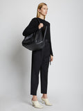 Image of model holding XL Ruched Tote in BLACK