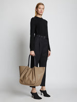 Image of model carrying XL Ruched Tote in LIGHT TAUPE